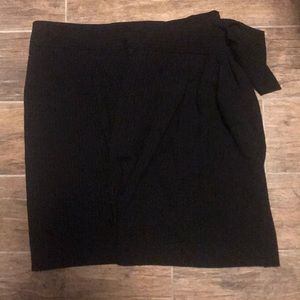 Black knee length wrap skirt, lined.